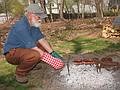 April 26, 2009 - Merrimac, Massachusetts.<br />Egils cooking Fowles sausages, two bratwursts and two kielbasas,<br />over the remains of the brush fire. They were yummy!