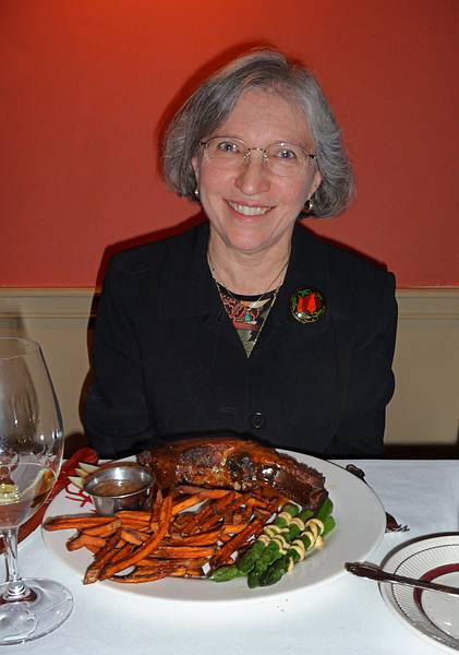 May 14, 2009 - Woodstock, Vermont.<br />At 'The Prince and the Pauper" restaurant.<br />Joyce with her 'Wood Smoked Pork Rib Chop', which was excellent.