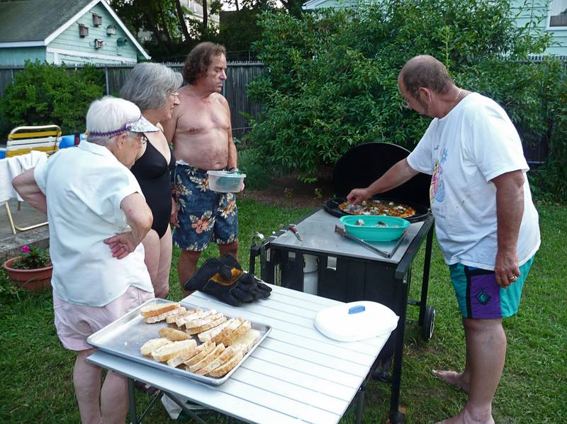 August 18, 2009 - At Marie's resort, Lawrence, Massachusetts.<br />Marie, Joyce, and Paul watch Dominic add shrimp to the paella.