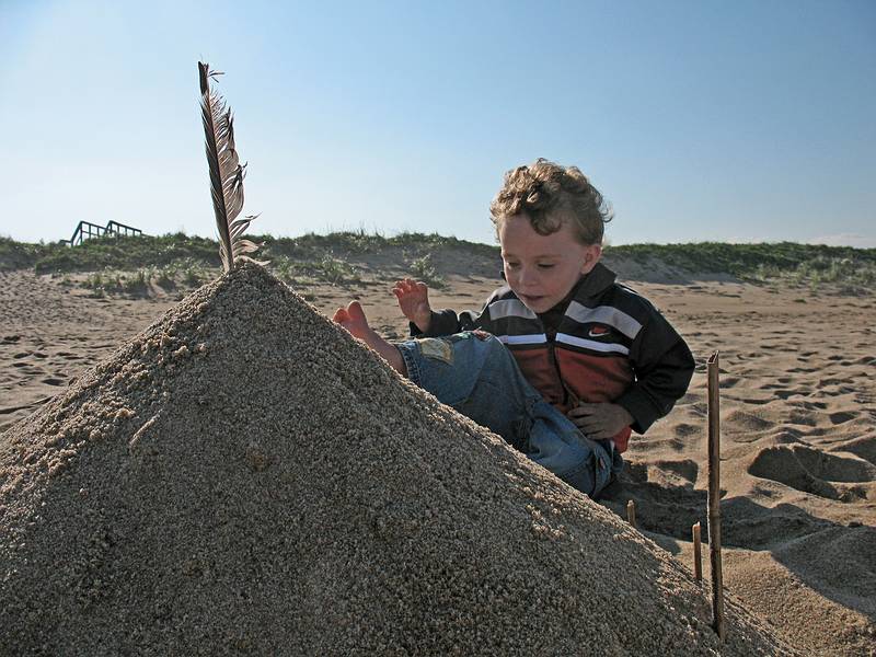 August 30, 2009 - Parker River National Wildlife Refuge, Plum Island, Massachusetts.<br />Matthew and cone of sand that he and I built.