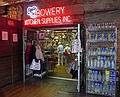 August 22, 2009 - Manhattan, New York, New York.<br />Chelsea Market (on 9th Ave, between 15th and 16th Streets).<br />Ronnie, ?, and Baiba inspecting the wares on one of the many stores in the market.