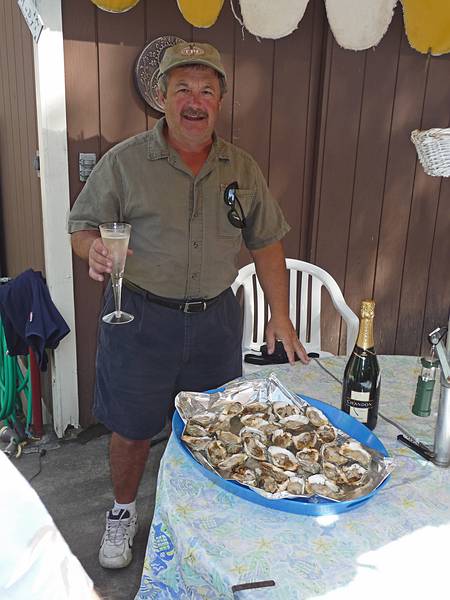 Sept 7, 2009 - At Marie's resort in Lawrence, Massachusetts.<br />Celebrating Paul L's retirement.<br />Paul L. and grilled oysters.