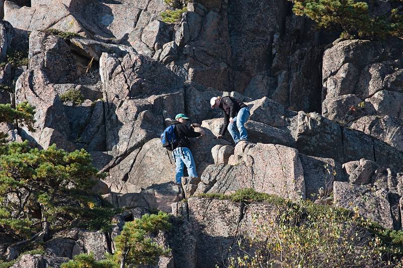 Sept. 25, 2009 - Acadia National Park, Maine.<br />Hikers climbing down The Beehive.