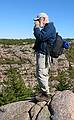 Sept. 26, 2009 - Acadia National Park, Maine.<br />Deb's view of me adjusting my glasses (photo by Deb).