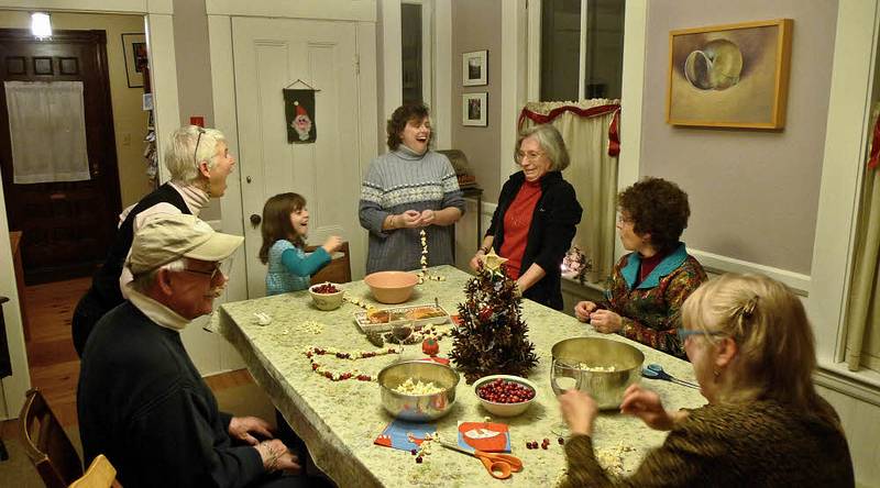 Dec. 23, 2009 - Christmas tree decorating party in Merrimac, Massachusetts.<br />Ray, Deb, Miranda, Holly, Joyce, Bonnie, and Nancy stringing popcorn and cranberries.<br />It looks like Joyce just told a funny story that amazed some and made other laugh.