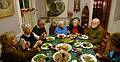 Dec. 23, 2009 - Christmas tree decorating party in Merrimac, Massachusetts.<br />The other end of the table: Nancy, Deb, Ray, Marie, Joyce, Egils, and Bonnie<br />enjoying the chicken Marbella that Joyce prepared (at Sati's request).