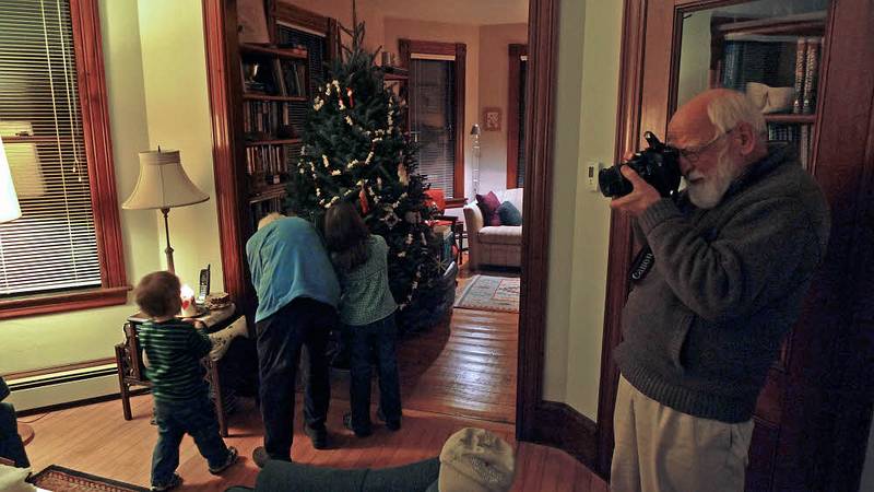 Dec. 23, 2009 - Christmas tree decorating party in Merrimac, Massachusetts.<br />Egils cought in the act (by my friend John)<br />while Matthew, Marie, and Miranda decorate the tree.