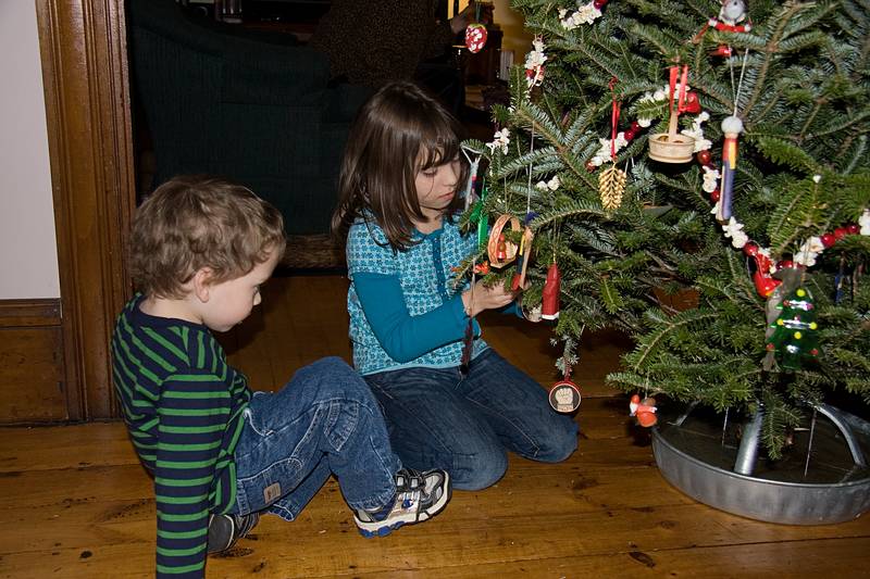 Dec. 23, 2009 - Christmas tree decorating party in Merrimac, Massachusetts.<br />Matthew watching Miranda hang a decoration.