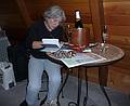 July 26, 2008 - Fort Klamath, Oregon.<br />Joyce recording the day's events in our cabin at Aspen Inn Motel.<br />The innkeeper provided us with "champagne" for our 25th wedding anniversary.