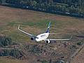 August 1, 2009 - Ballooning in Kelowna, British Columbia, Canada.<br />In this telephoto shot the plane looks closer than it actually was.
