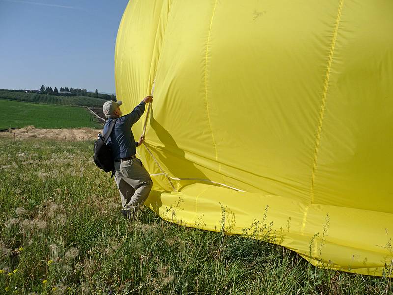 August 1, 2009 - Ballooning in Kelowna, British Columbia, Canada.<br />I am trying to prevent the balloon from rolling in the breeze.