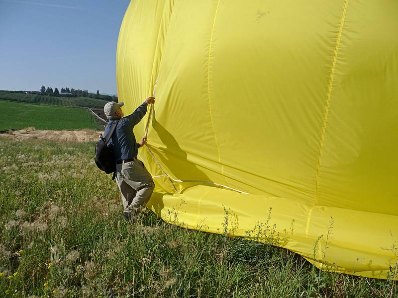 August 1, 2009 - Ballooning in Kelowna, British Columbia, Canada.<br />I am trying to prevent the balloon from rolling in the breeze.