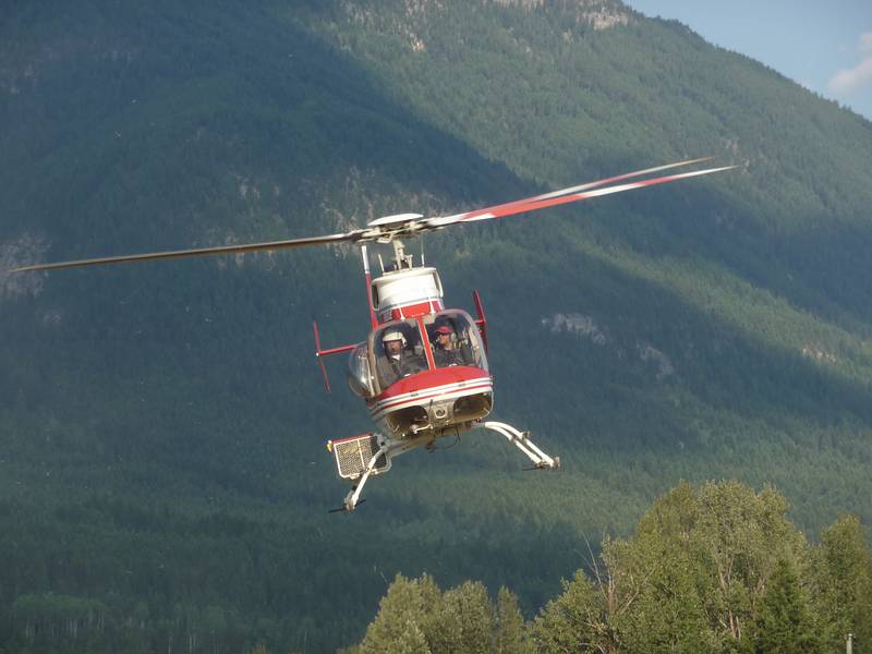August 2, 2009 - Back at the Golden Eco-Adventure Ranch, Nicholson, British Columbia, Canada.<br />A rescue helicopter picks up a medic and heads out to retrieve a treed paraglider pilot<br />(she ended up on the wrong side of a ridge but was unhurt).