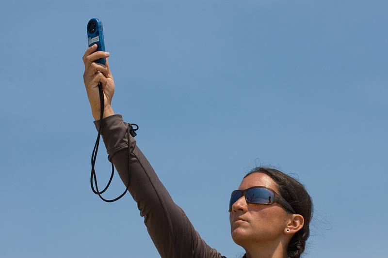 August 13, 2009 - Dunes State Park (on Monterey Bay), Sand City, California.<br />Melody checking the wind speed.