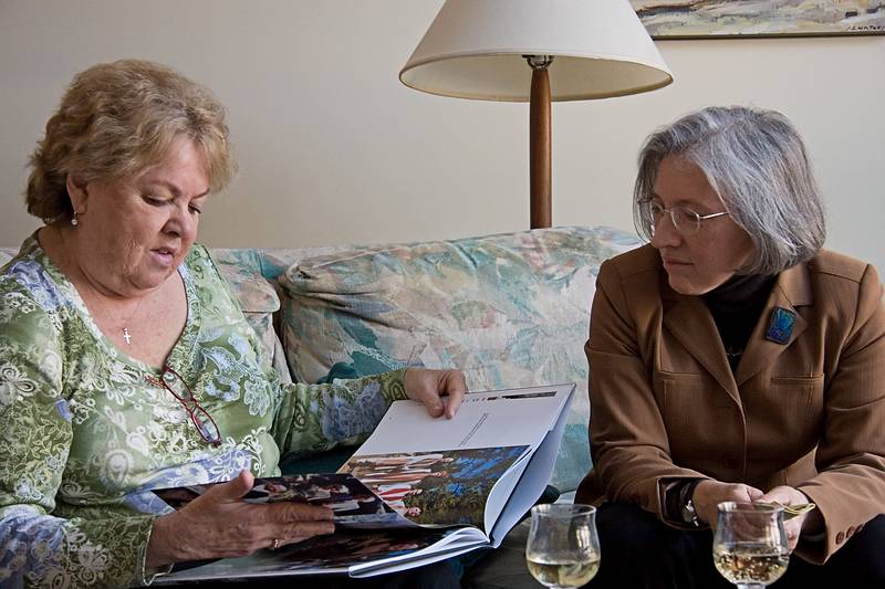 Jan. 21, 2010 - At Uldis, Edite, and Mirdza's in Manchester by the Sea, Massachusetts.<br />Mirdza's 95th birthday.<br />Helga looking at book of Melody and Sati's wedding and Joyce.
