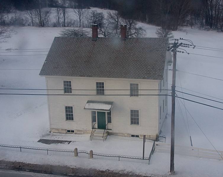 Jan. 10, 2010 - Hancock Shaker Village, Hancock, Massachusetts.<br />Meetinghouse, 1793, seen through a pane of dirty, old window glass<br />of the  Brick Dwelling.