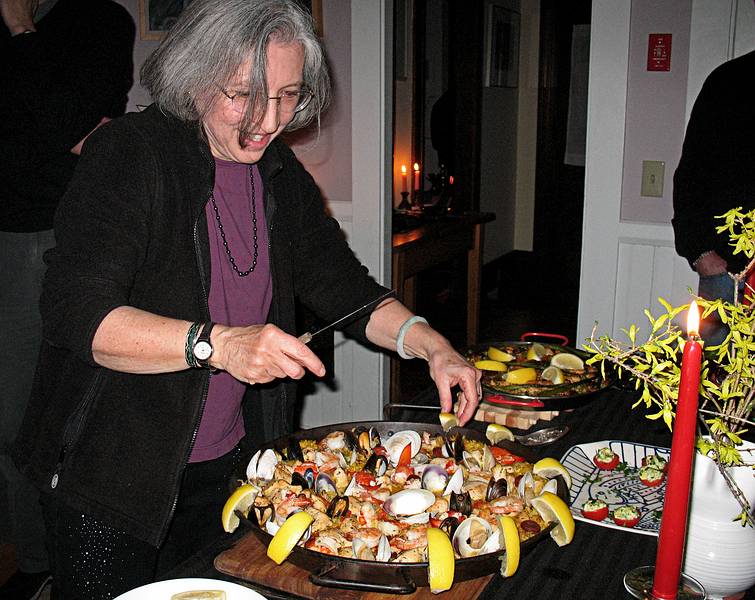 Joyce doing final touches on her paella.<br />March 27, 2010 - Earth Hour party with a Spanish theme, Merrimac, Massachusetts.