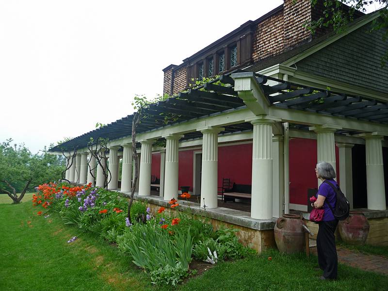 Joyce admiring flowers in front of The Little Studio.<br />June 1, 2010 - Augustus Saint-Gaudens National Historic Park, Cornish, New Hampshire.