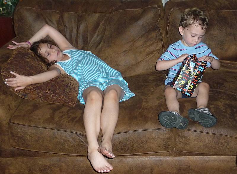 Miranda is bored while Matthew opens another present.<br />June 27, 2010 - Mandon, Massachusetts.