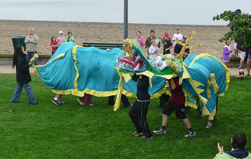 Dragon from nearby town of Nobel.<br />Dragon boat festival.<br />June 12, 2010 - Parry Sound, Ontario, Canada.