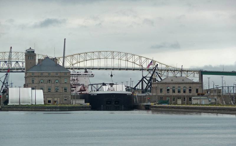 The 'Burns Harbor' exiting the locks after having been lowered 21 ft. to the level of Lake Huron.<br />Soo Locks boat tour.<br />June 14, 2010 - Sualt Ste. Marie, Michigan.