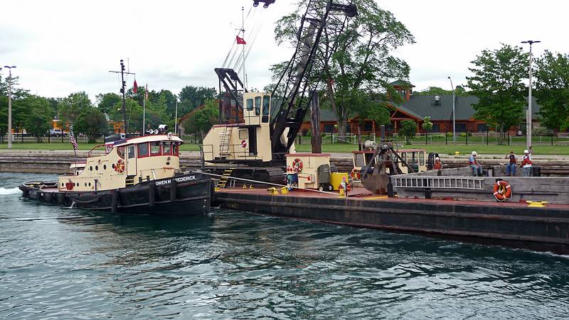 The Owen Frederick pushing the US Army Corps of Engineers barge.<br />Soo Locks boat tour.<br />June 14, 2010 - Sualt Ste. Marie, Michigan.