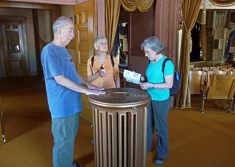 Ronnie, Baiba, and Joyce around the radiator in the moddle of one of the corner rooms.<br />Mabel Tainter Memorial.<br />June 17, 2010 - Menomonie, Wisconsin.