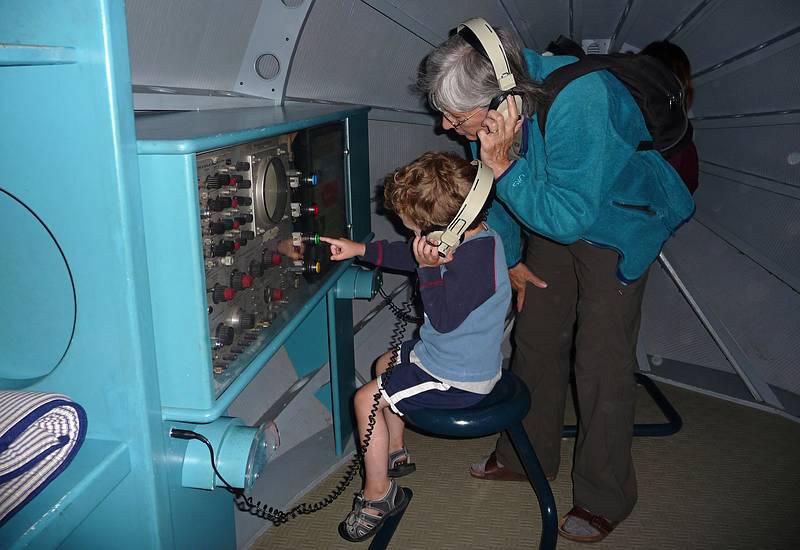 Matthew operating the sonar in the submarine while Joyce listens in.<br />July 1, 2010 - Childrens' Museum in Dover, New Hamshire.