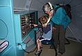 Matthew operating the sonar in the submarine while Joyce listens in.<br />July 1, 2010 - Childrens' Museum in Dover, New Hamshire.
