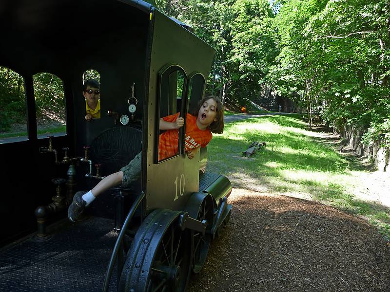 Miranda yelling "all aboard".<br />On or along the Clipper City Rail Trail.<br />July 2, 2010 - Newburyport, Massachusetts.
