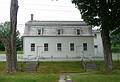 The Meetinghouse. with separate steps and doors for the brothers and sisters.<br />July 8, 2010 - Sabbathday Lake Shaker Village, New Gloucester, Maine.