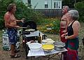 Paul, Jim, and Joyce discussing the finer points of making a paella.<br />August 8, 2010 - At Marie's in Lawrence, Massachusetts.