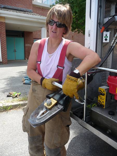 Sue showing us the jaws of life.<br />Old Home Days.<br />August 14, 2010 - Merrimac, Massachusetts.