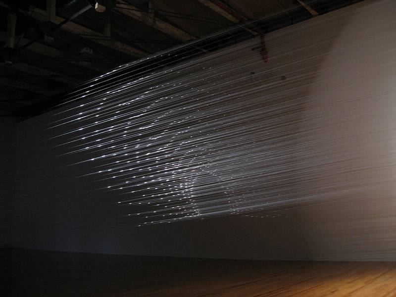 Tobias Putrih's installation, monofilament and a spotlight.<br />August 22, 2010 - Mass Moca, North Adams, Massachusetts.