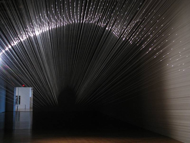 Tobias Putrih's installation, monofilament and a spotlight.<br />August 22, 2010 - Mass Moca, North Adams, Massachusetts.