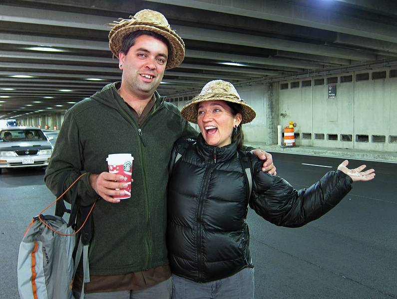 Sati and Melody with Indonesian peasant hats.<br />Nov. 11, 2010 - Logan Airport, Boston, Massachusetts.