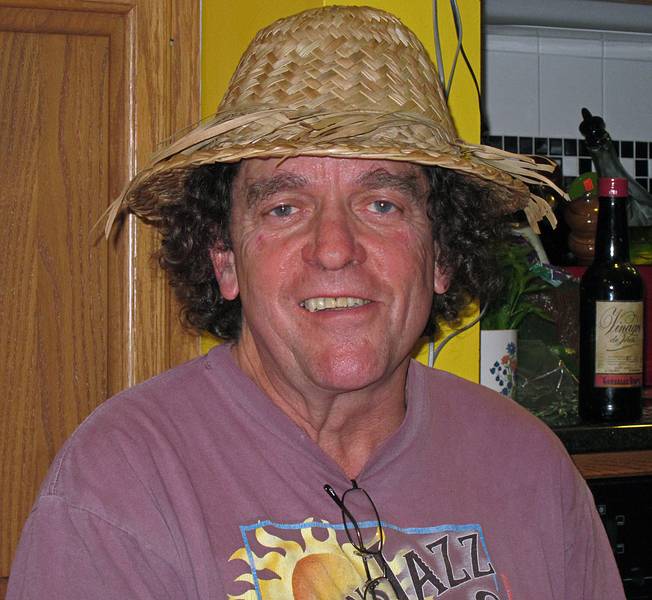 Paul wearing the Indonesian farmers hat that Melody and Sati gave him.<br />Nov. 13, 2010 - At Paul and Norma's in Tewksbury, Massachusetts.