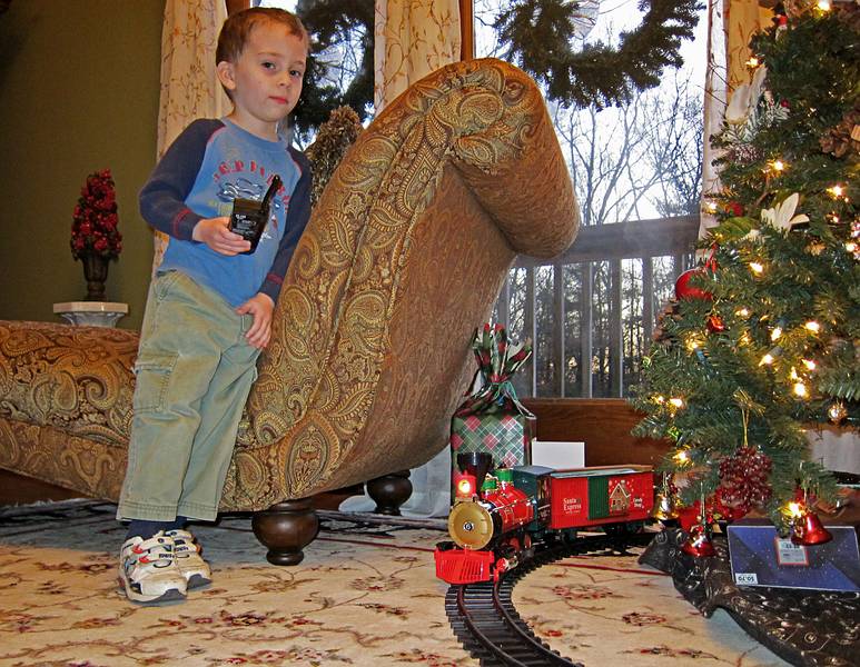 Matthew operating the train with the remote control.<br />Dec. 17, 2010 - At Carl and Holly's in Mendon, Massachusetts.