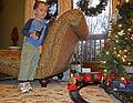 Matthew operating the train with the remote control.<br />Dec. 17, 2010 - At Carl and Holly's in Mendon, Massachusetts.