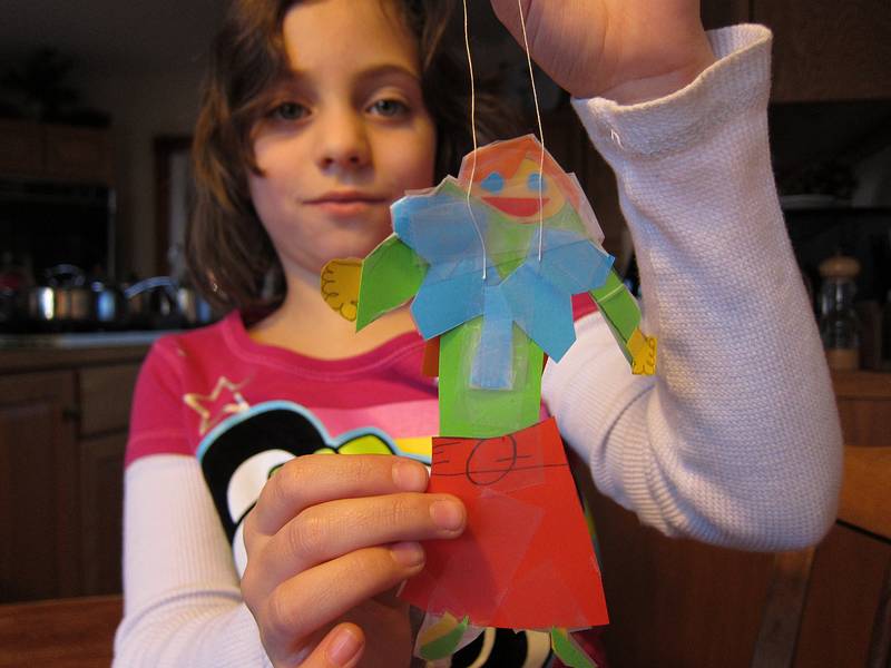 Miranda showing her just made Christmas decoration.<br />Christmas tree decorating party.<br />Dec. 18, 2010 - Merrimac, Massachusetts.