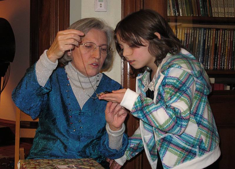Joyce and Miranda inspecting a piece of jewelry.<br />Dec. 25, 2010 - Christmas Day at Joyce and Egils' in Merrimac, Massachusetts