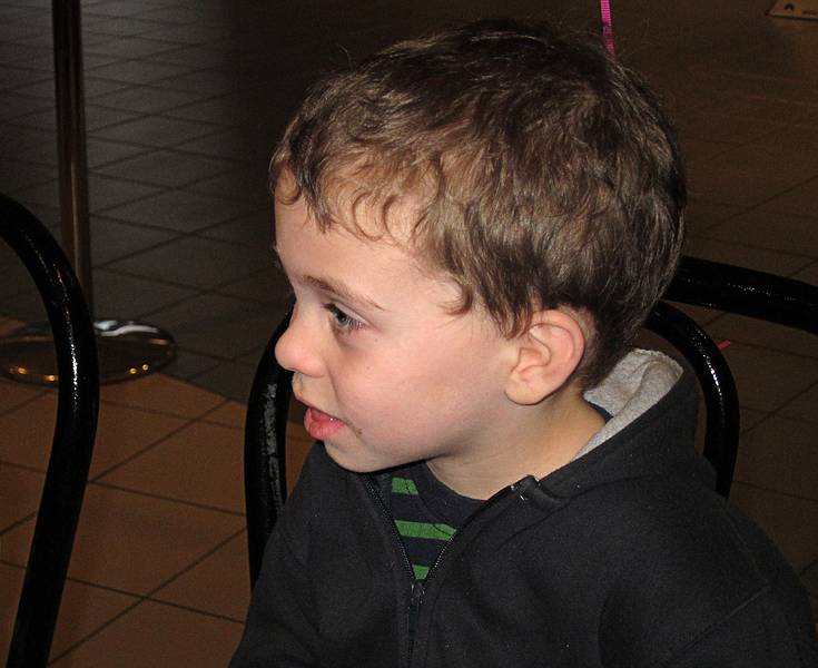 Matthew just observing what's going on.<br />Miranda's 9th birthday celebration.<br />Jan. 2, 2011 - Regal Cinemas, Bellingham, Massachusetts.