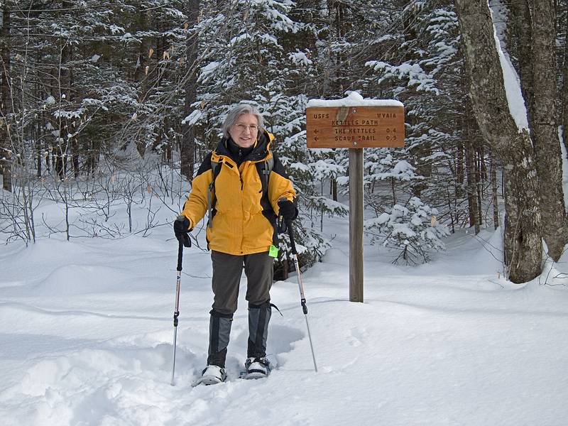 Joyce at the junction of Livermore Rd, and Kettles Path.<br />Hike from the Depot to the Scaur via Livermore, Kettles, and Scaur trails.<br />Jan. 30, 2011 - Waterville Valley, New Hampshire.