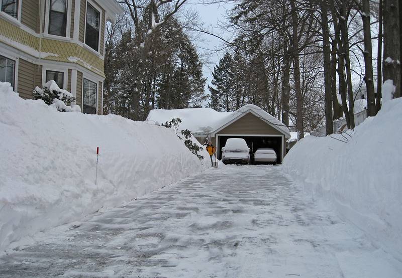 Joyce standing next to walkway to the back door.<br />Joyce and I just finished shoveling for the 4th time between yesterday's and today's snow.<br />Feb. 2, 2011 - Merrimac, Massachusetts.