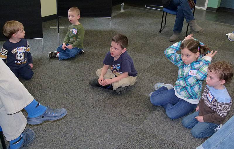 Miranda, Matthew, and other kids listening to a lecture about marine mammals.<br />March 5, 2011 - Mass Audubon at Joppa Flats, Newburyport, Massachusetts.