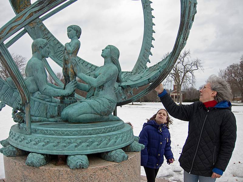 Miranda and Joyce inspecting a spherical sundial.<br />March 6, 2011 - Phillips Academy, Andover, Massachusetts.