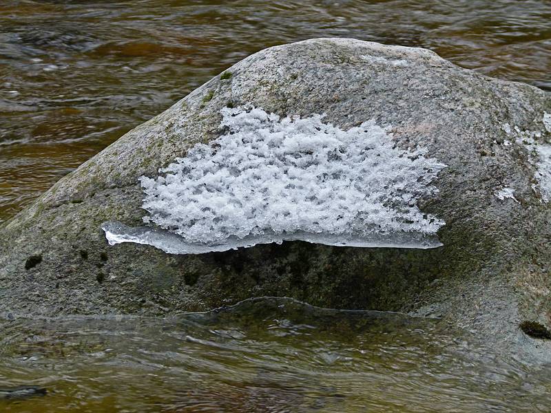 Ice shelf on rock In the Slide Brook.<br />March 12, 2011 - Waterville Valley, New Hampshire.