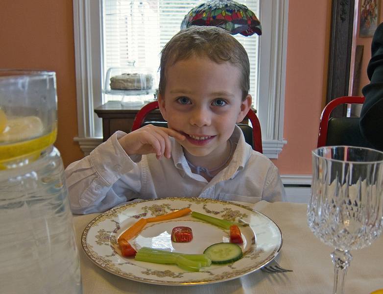 Matthew arranged his vegetables around a piece of chocolate.<br />April 24, 2011 - Easter dinner at Paul and Norma's in Tewksbury, Massachsuetts.