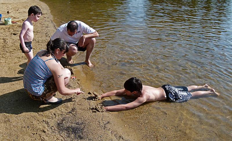 Marks, Melody, Eric, and Gujn playing on the beach.<br />June 20, 2011 - Pawtuckaway State Park, Nottingham, New Hampshire.