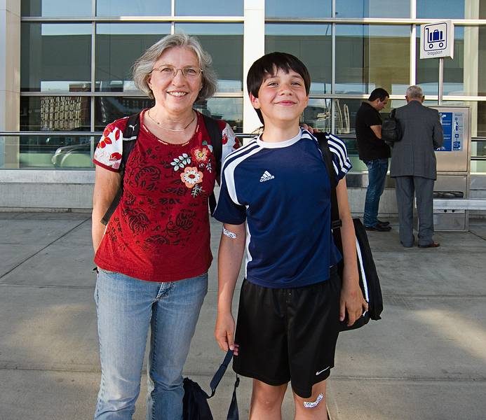 Jooyce, and Gujn streching trying to be taller than Joyce.<br />June 27, 2011 - Logan Airport, Boston, Massachusetts.